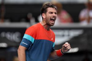 Cam Norrie roars in celebration after a win at the ASB Classic
