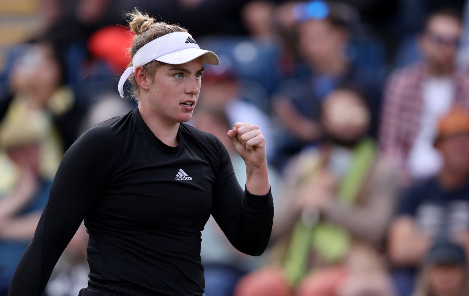 Amelia Rajecki raising her fist in celebration after winning a point at the Lexus Birmingham Open