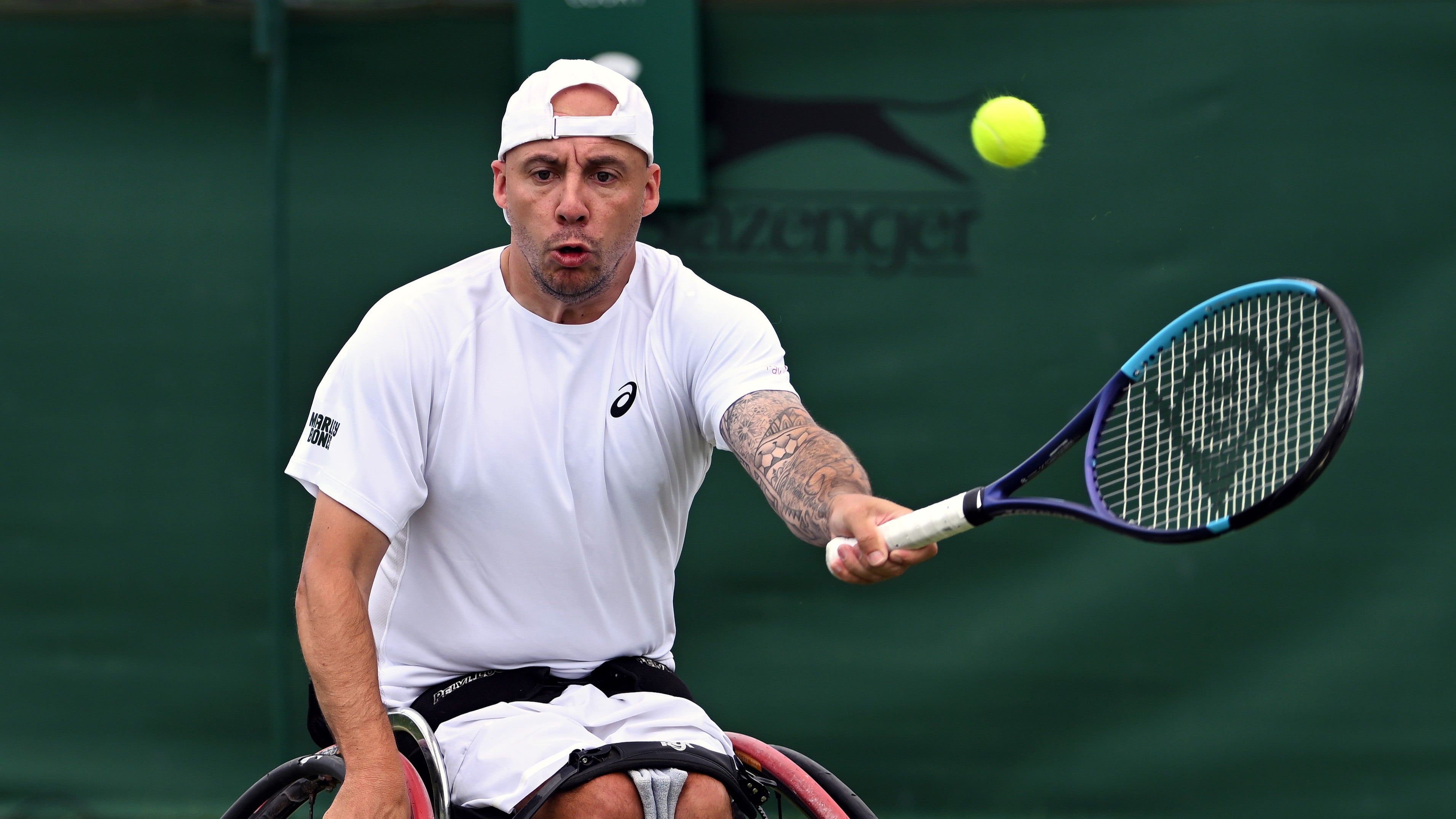 Andy Lapthorne hits a forehand during the first round of the quad singles at the Lexus British Open Roehampton