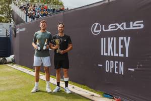Marcus Willis and David Stevenson holding their trophies at the Lexus Ilkley Open 