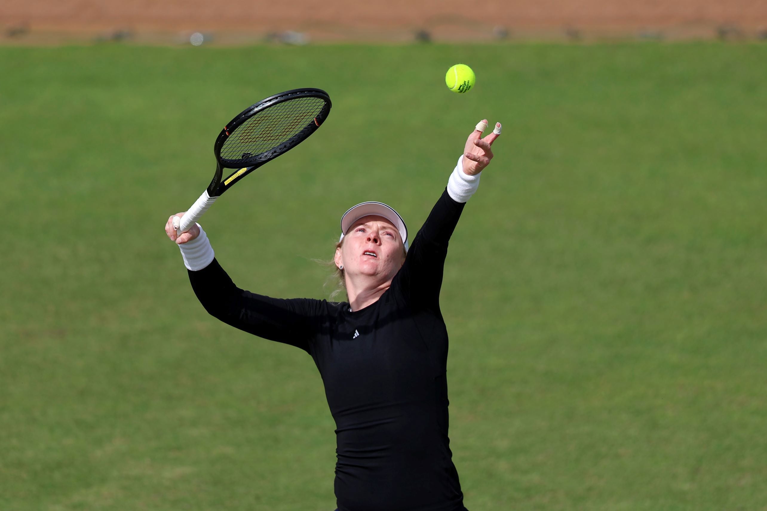Francesca Jones throws the ball up ready to serve