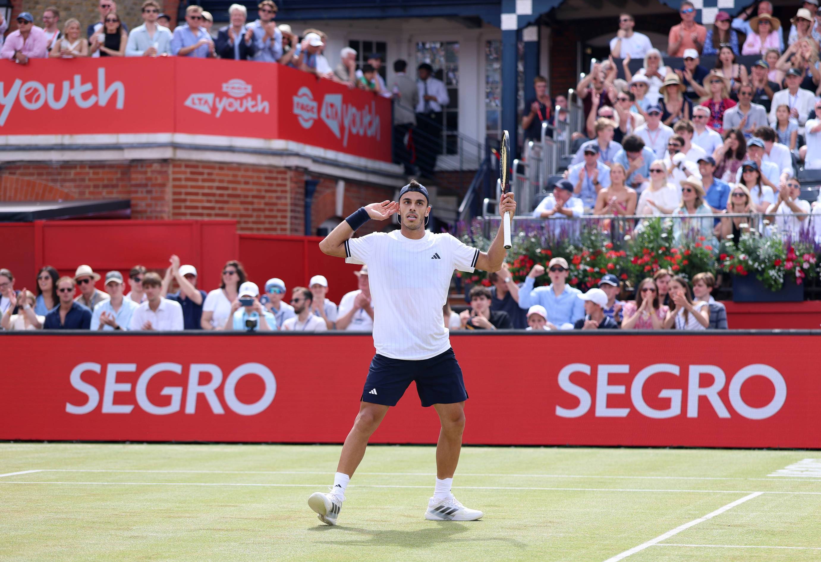 Francisco Cerundolo cups his ear in celebration in the semi-finals of the HSBC Championships