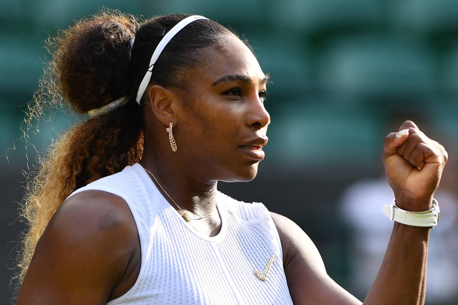 Serena Williams gives a fist pump celebration during a match at Wimbledon