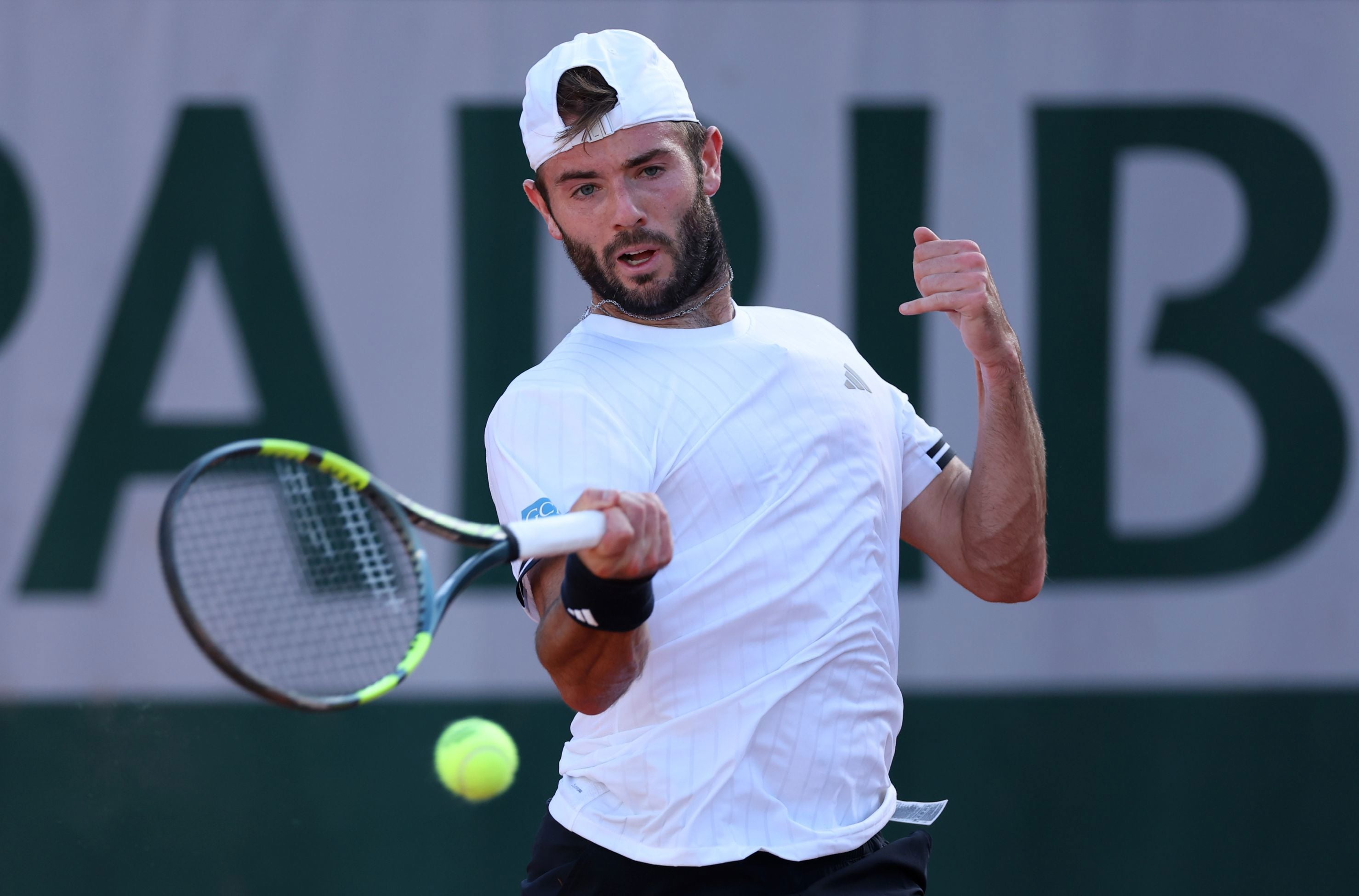 British tennis player Jacob Fearnley hitting a forehand on court during his first round  match against Juan Manuel Cerundolo at Roland Garros