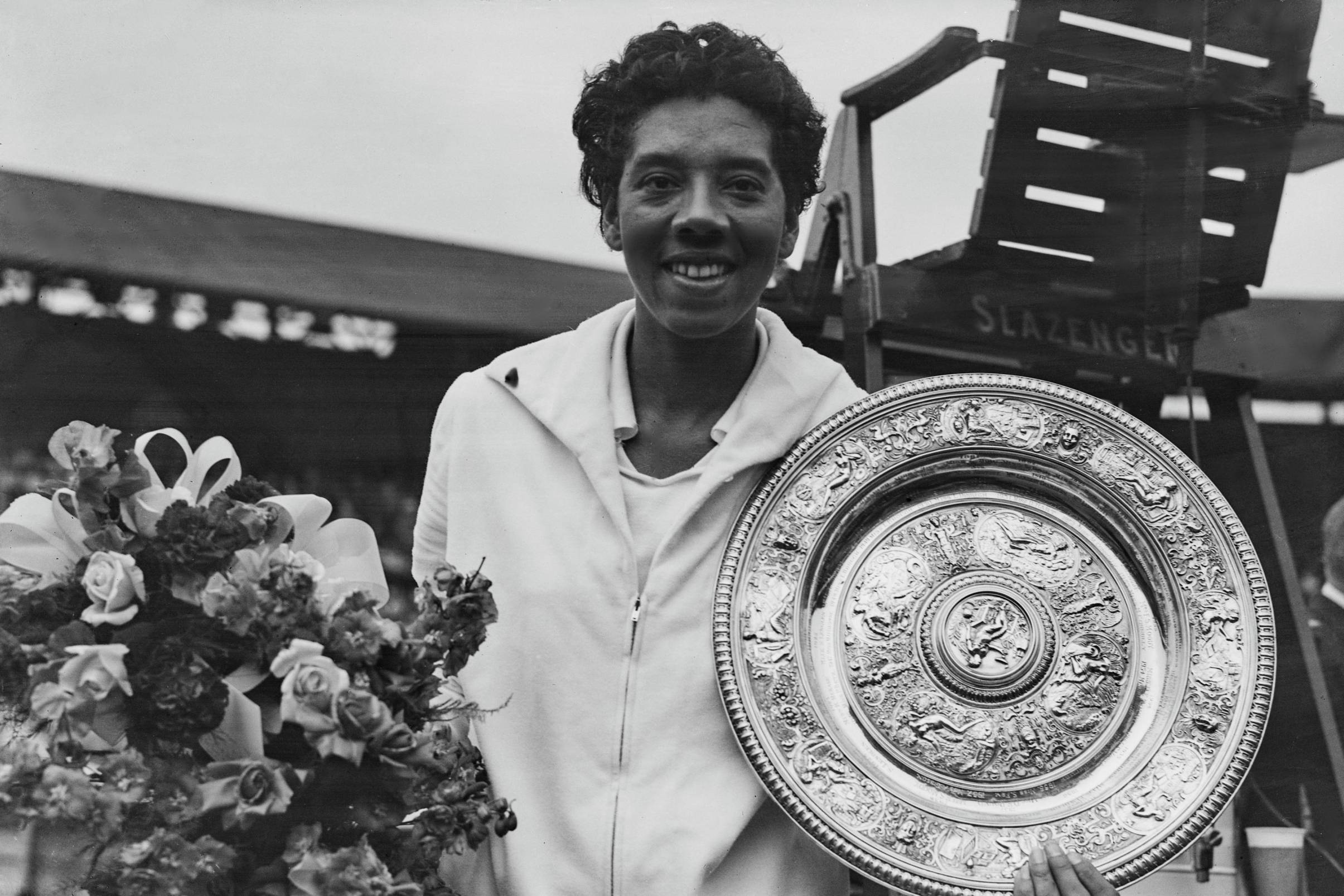 Althea Gibson holding the 1958 Wimbledon women's singles title