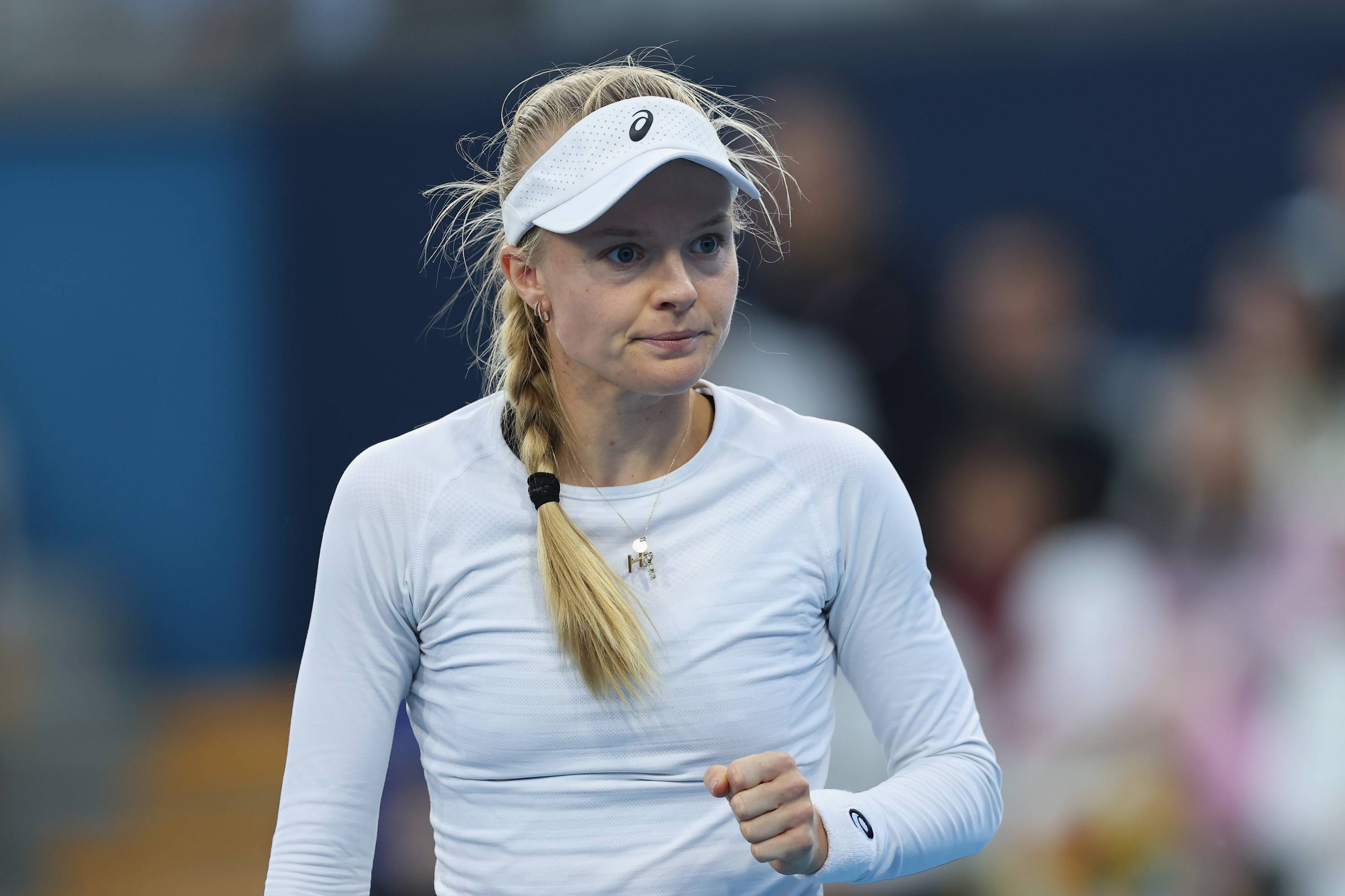 British tennis star Harriet Dart celebrates winning a point during a match 