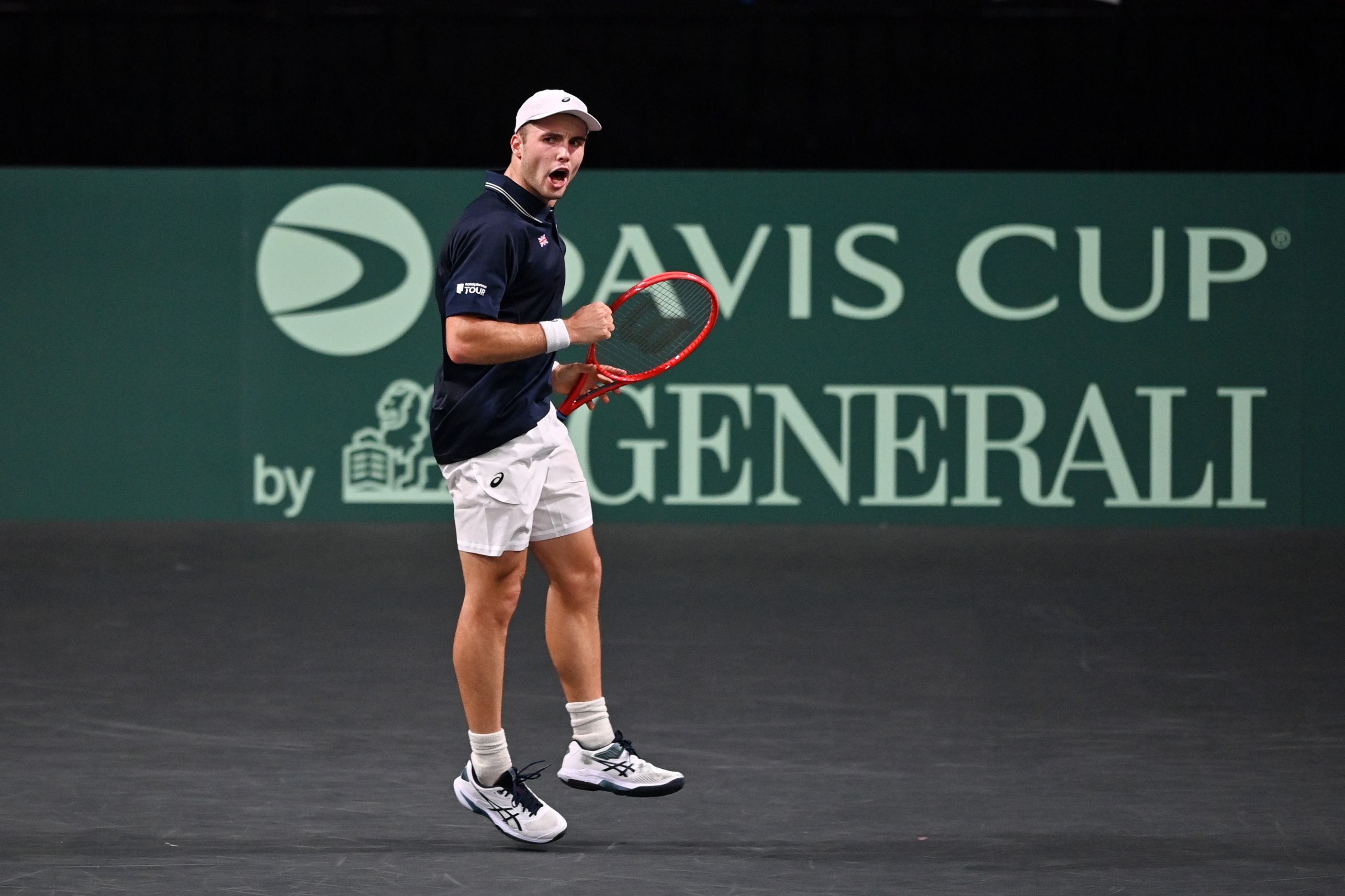 Arthur Fery clenching his fist and celebrating on court at the Davis Cup 