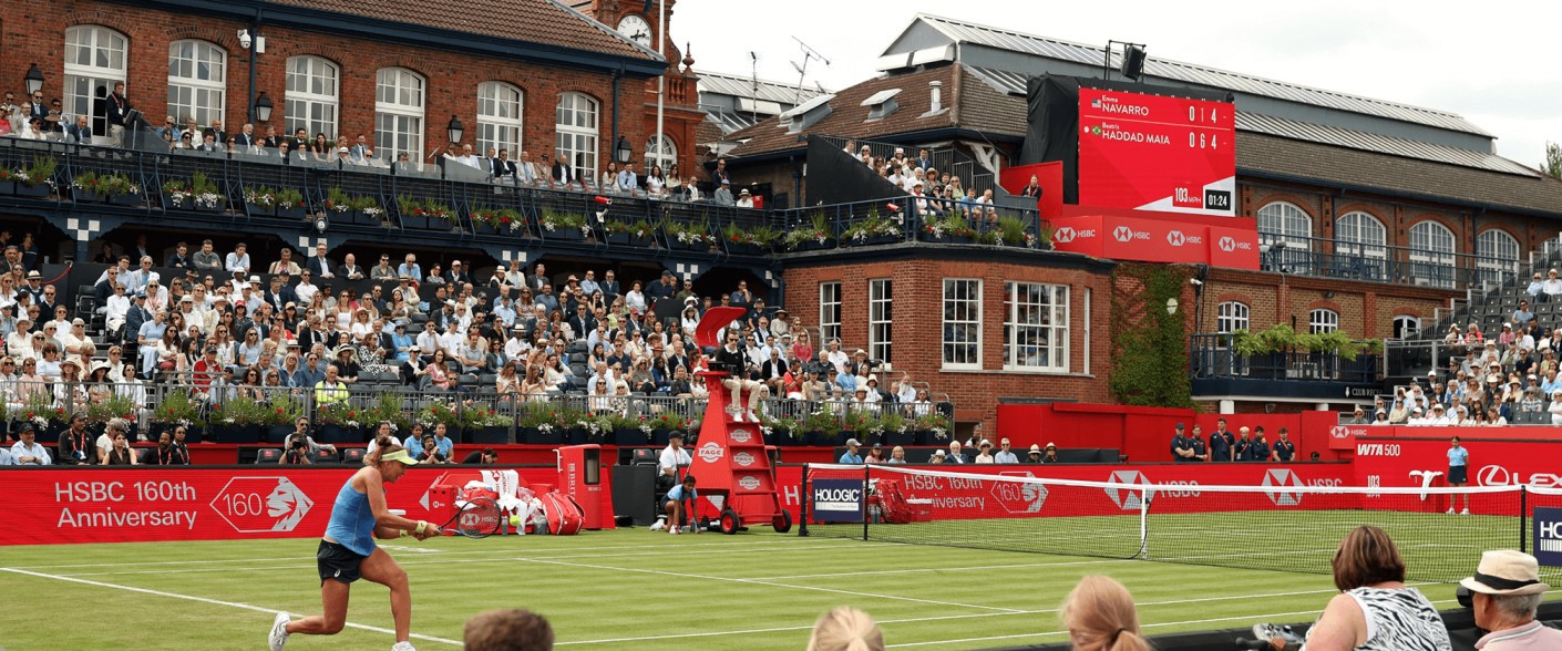 Beatriz Haddad Maia hits a backhand at The Queen's Club in front of the club house