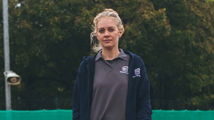 Becky Davies on a tennis court
