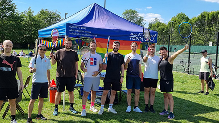 team of south london smashers standing in front of all stars tennis tent outside tennis courts