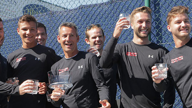 mens players wearing full sleeve black tops with trophies in hand