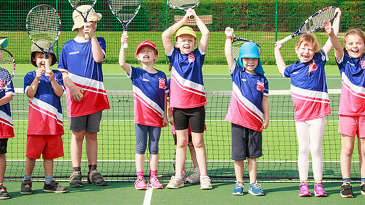 Group of boys and girls cheering for tennis