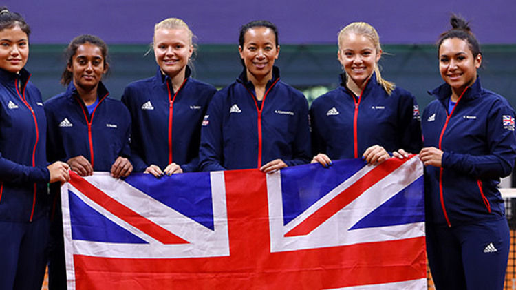 GB Fed cup team holding the flag