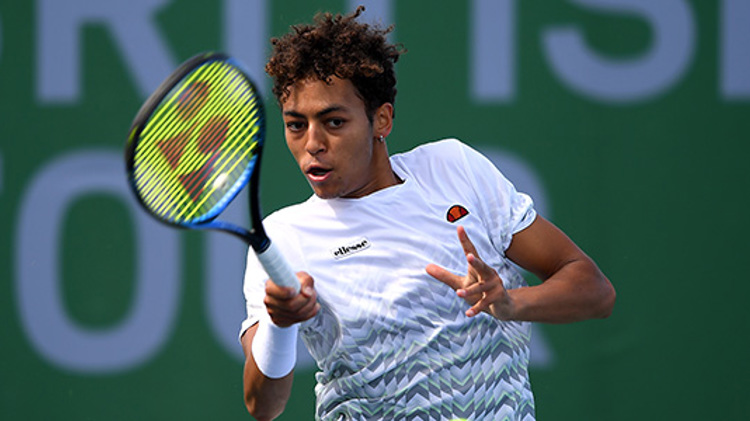 Paul Jubb playing a tennis match at British Tour