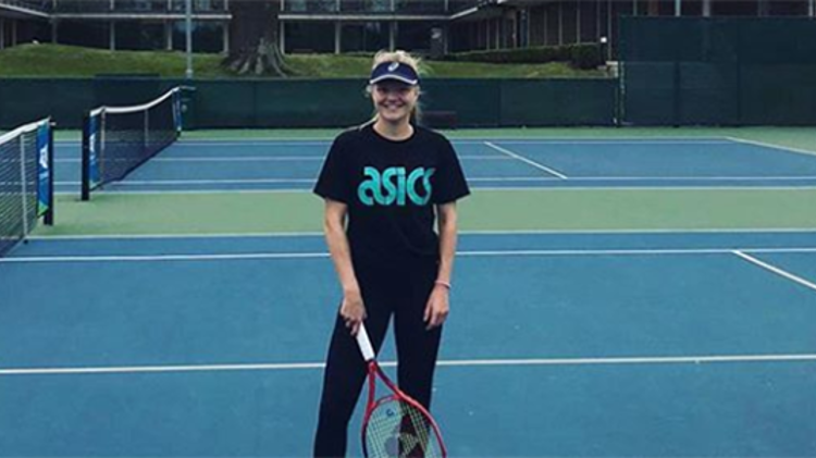 Harriet Dart smiling on tennis court at the NTC