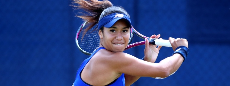 close up of heather watson on court swinging racket back to play a backhand