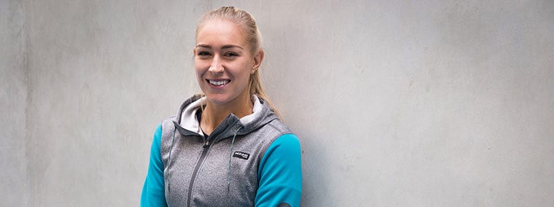 header image of jocely rae smiling wearing blue and grey sweater