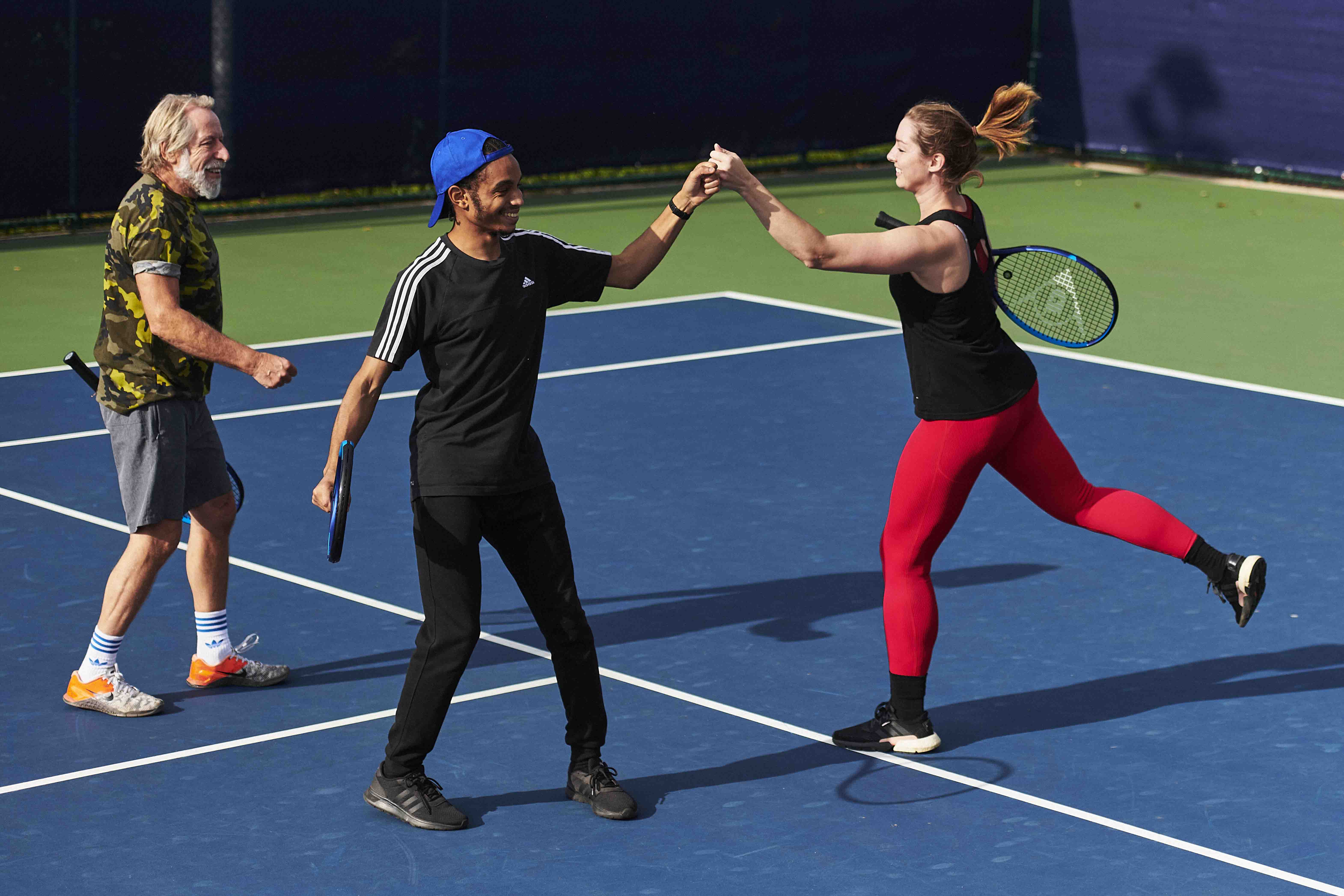 Players fist bumping on court.jpg