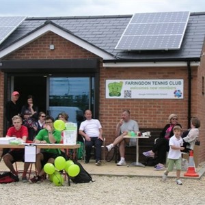 Members of Farringdon tennis club sitting outside their clubhouse